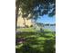 Scenic view of the lake with picnic tables and benches by the building at 3697 Lake Bayshore Dr # H-109, Bradenton, FL 34205