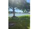 Picturesque lake view and verdant grounds with mature trees and beautiful setting at 3697 Lake Bayshore Dr # H-109, Bradenton, FL 34205