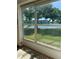 Lanai view showing a lake, lawn, and condo buildings at 3697 Lake Bayshore Dr # H-109, Bradenton, FL 34205