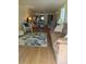 Inviting living room with wood floors, neutral walls, a comfortable couch, and ample seating at 3697 Lake Bayshore Dr # H-109, Bradenton, FL 34205