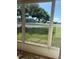 Relaxing sunroom provides beautiful view of the lake and lush green grounds at 3697 Lake Bayshore Dr # H-109, Bradenton, FL 34205