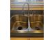 Kitchen featuring a double stainless steel sink with a modern faucet and a view from the window at 3697 Lake Bayshore Dr # H-109, Bradenton, FL 34205