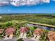 Aerial view of a single-Gathering home with a pond in the backyard at 371 Capulet Dr, Venice, FL 34292