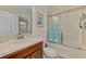 Bathroom featuring a vanity, toilet, and shower with glass doors at 371 Capulet Dr, Venice, FL 34292