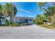 The South Venice Beach Ferry station surrounded by lush trees, offering rides to the beach at 371 Capulet Dr, Venice, FL 34292