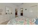 Bedroom featuring a queen bed, dresser, and access to the living room and bathroom at 371 Capulet Dr, Venice, FL 34292