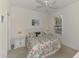 Bedroom with a ceiling fan, a queen bed, and a window at 371 Capulet Dr, Venice, FL 34292