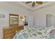 This bedroom has a bamboo dresser and tropical accents at 371 Capulet Dr, Venice, FL 34292