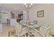 Inviting dining area with view into the kitchen and breakfast bar provides ample space for meals and entertaining at 371 Capulet Dr, Venice, FL 34292
