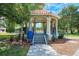 Park gazebo featuring stairs, railings and tiled roof at 371 Capulet Dr, Venice, FL 34292