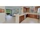 Modern kitchen with granite counters, stainless appliances, and an open view to the living area at 371 Capulet Dr, Venice, FL 34292