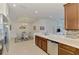 Kitchen view including granite counters, stainless steel appliances, and an adjacent dining area at 371 Capulet Dr, Venice, FL 34292