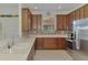 Kitchen view boasting stone backsplash, stainless steel appliances, and ample cabinet space at 371 Capulet Dr, Venice, FL 34292