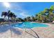 Inviting community pool with a spacious patio and comfortable lounge chairs for relaxation and socializing at 371 Capulet Dr, Venice, FL 34292