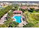 Aerial view of a sparkling community pool and well-maintained landscaping at 371 Capulet Dr, Venice, FL 34292