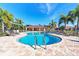 Inviting community pool with a spacious patio and comfortable lounge chairs for relaxation at 371 Capulet Dr, Venice, FL 34292