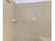 Tiled shower with seating and showerhead at 371 Capulet Dr, Venice, FL 34292