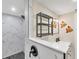 Contemporary bathroom featuring a walk-in shower, shelf and modern fixtures at 386 Nightingale Rd, Venice, FL 34293