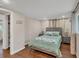 Comfortable bedroom featuring tiled floors, calming decor, and an attached closet at 386 Nightingale Rd, Venice, FL 34293