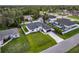 Aerial view showcasing the property's well-manicured lawn, landscaping, and a long driveway at 4033 Union Ln, North Port, FL 34288