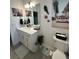 Bathroom features light counters, decorative wall art, and vanity at 4033 Union Ln, North Port, FL 34288