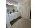 Elegant bathroom with dual sinks, quartz countertops, and modern fixtures at 4033 Union Ln, North Port, FL 34288