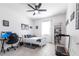 Well-lit bedroom featuring a desk, bookshelf, and treadmill at 4033 Union Ln, North Port, FL 34288