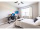 Bedroom features neutral walls, black desk, ceiling fan, and a large window at 4033 Union Ln, North Port, FL 34288