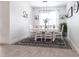 Inviting dining room with a stylish light fixture, a clean color palette and simple decor at 4033 Union Ln, North Port, FL 34288
