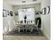 Elegant dining room with modern light fixture and patterned rug at 4033 Union Ln, North Port, FL 34288