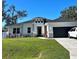 Charming single Gathering home featuring fresh landscaping and a two-car garage at 4033 Union Ln, North Port, FL 34288