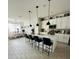 Modern kitchen with white cabinets, quartz countertops, and stainless steel appliances at 4033 Union Ln, North Port, FL 34288