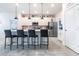 Bright kitchen with stainless steel appliances, a large island with bar seating, and a convenient pantry at 4033 Union Ln, North Port, FL 34288