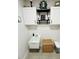 Laundry room with white utility sink and shelving decor at 4033 Union Ln, North Port, FL 34288