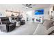 Open concept living room showcasing a modern fireplace, and wood-look floors at 4033 Union Ln, North Port, FL 34288