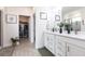 The main bathroom includes double sinks, a walk-in closet, and stylish finishes at 4033 Union Ln, North Port, FL 34288