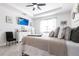 Relaxing main bedroom showcasing a comfortable bed, a ceiling fan, and a minimalist design at 4033 Union Ln, North Port, FL 34288