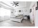 Spacious main bedroom with a tray ceiling, neutral decor, and a large window with natural light at 4033 Union Ln, North Port, FL 34288