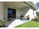 Outdoor patio area with a sitting area, plants, and outdoor turf at 4033 Union Ln, North Port, FL 34288