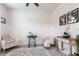 Bright sitting area featuring a patterned rug, chairs, and decorative side tables at 4033 Union Ln, North Port, FL 34288