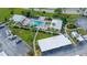 Aerial view of community pool with lounge chairs and tropical landscaping at 408 Cerromar S Cir # 331, Venice, FL 34293