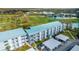 Aerial view of the condo community near a golf course and pond at 408 Cerromar S Cir # 331, Venice, FL 34293