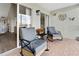 Comfortable balcony with rocking chairs and a view of the interior through sliding glass doors at 408 Cerromar S Cir # 331, Venice, FL 34293