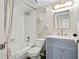 Cozy bathroom featuring a shower/tub combo and vanity with modern lighting and mirror at 408 Cerromar S Cir # 331, Venice, FL 34293