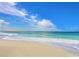 Serene view of the beach with clear turquoise waters and white sandy shore at 408 Cerromar S Cir # 331, Venice, FL 34293