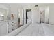 Bedroom with a laundry closet and an in-suite bathroom for easy access and added privacy at 408 Cerromar S Cir # 331, Venice, FL 34293