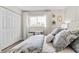 Bedroom features a nicely made bed, wooden floors, and a built-in desk with chair at 408 Cerromar S Cir # 331, Venice, FL 34293