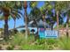 Venice Beach community sign amidst palm trees and lush vegetation, inviting visitors at 408 Cerromar S Cir # 331, Venice, FL 34293