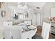 Dining area with white table and chairs, leading to kitchen at 408 Cerromar S Cir # 331, Venice, FL 34293