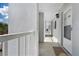Long hallway with multiple entry points and railing, showing exterior space at 408 Cerromar S Cir # 331, Venice, FL 34293